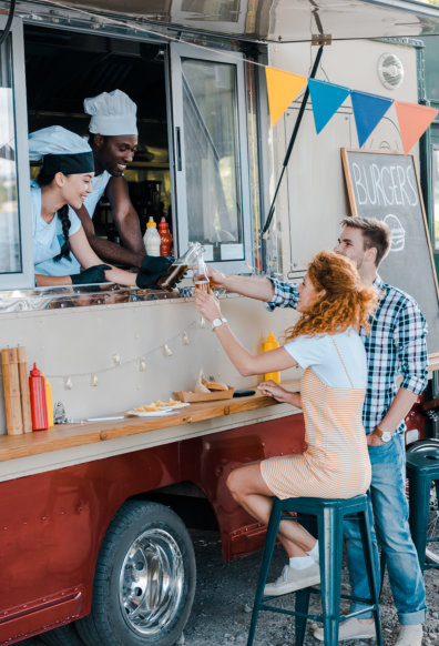 couple buying food in food truck