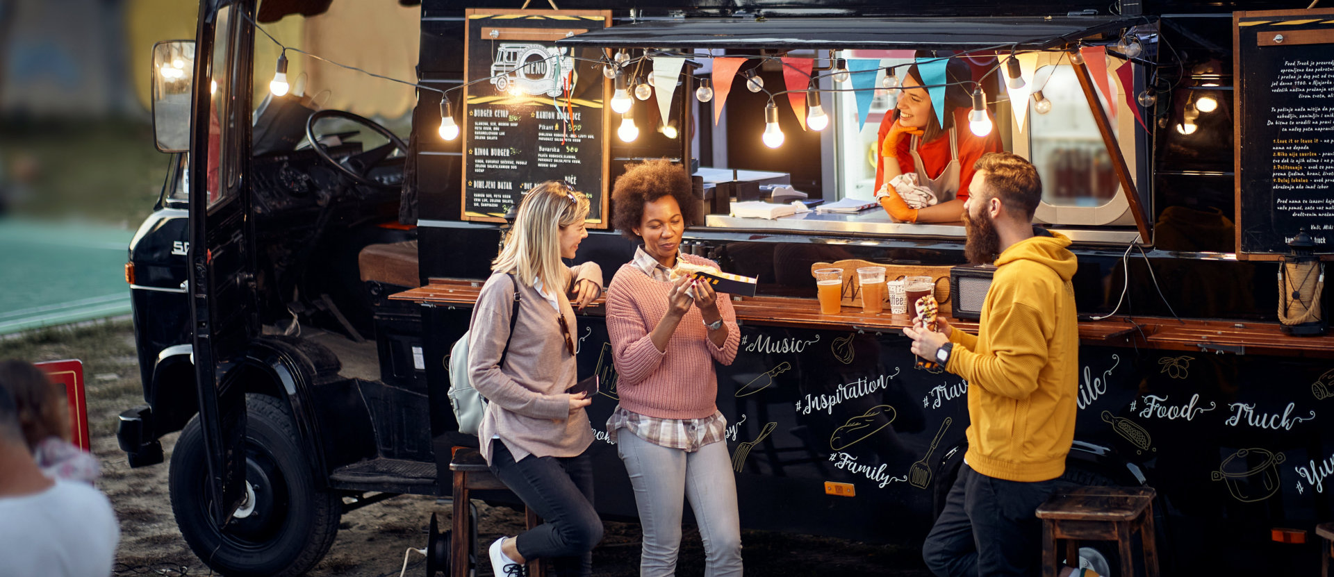 customers eating near food truck