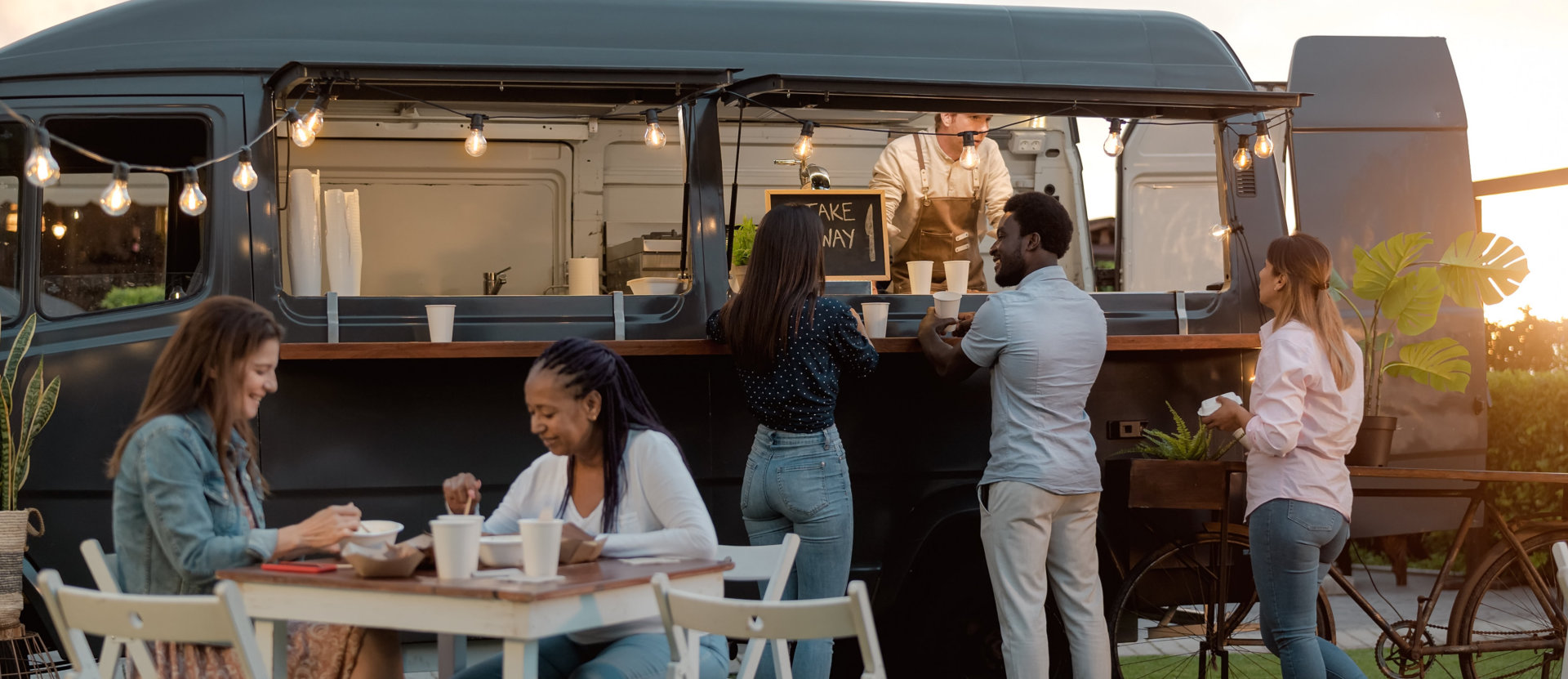 people ordering on food truck